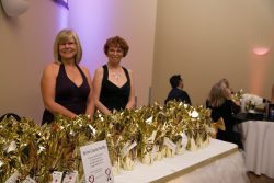 Two NOFCC volunteers preparing gifts at the Gold Soirée